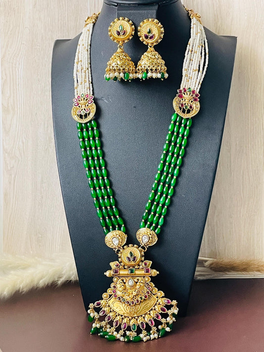 Gold platedkemp stonepearl green beads and big pendant . 4 strands of green beads and pearls on each size . Pendant ia2.5 inch long