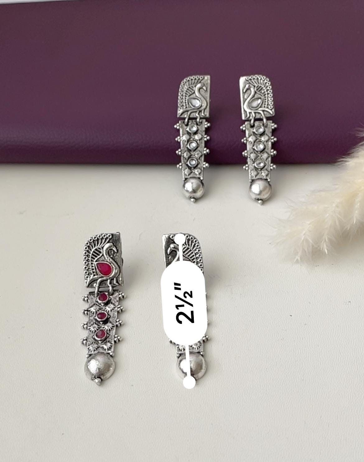 Silver lookalike peacock Oxidised earrings in Ruby and white