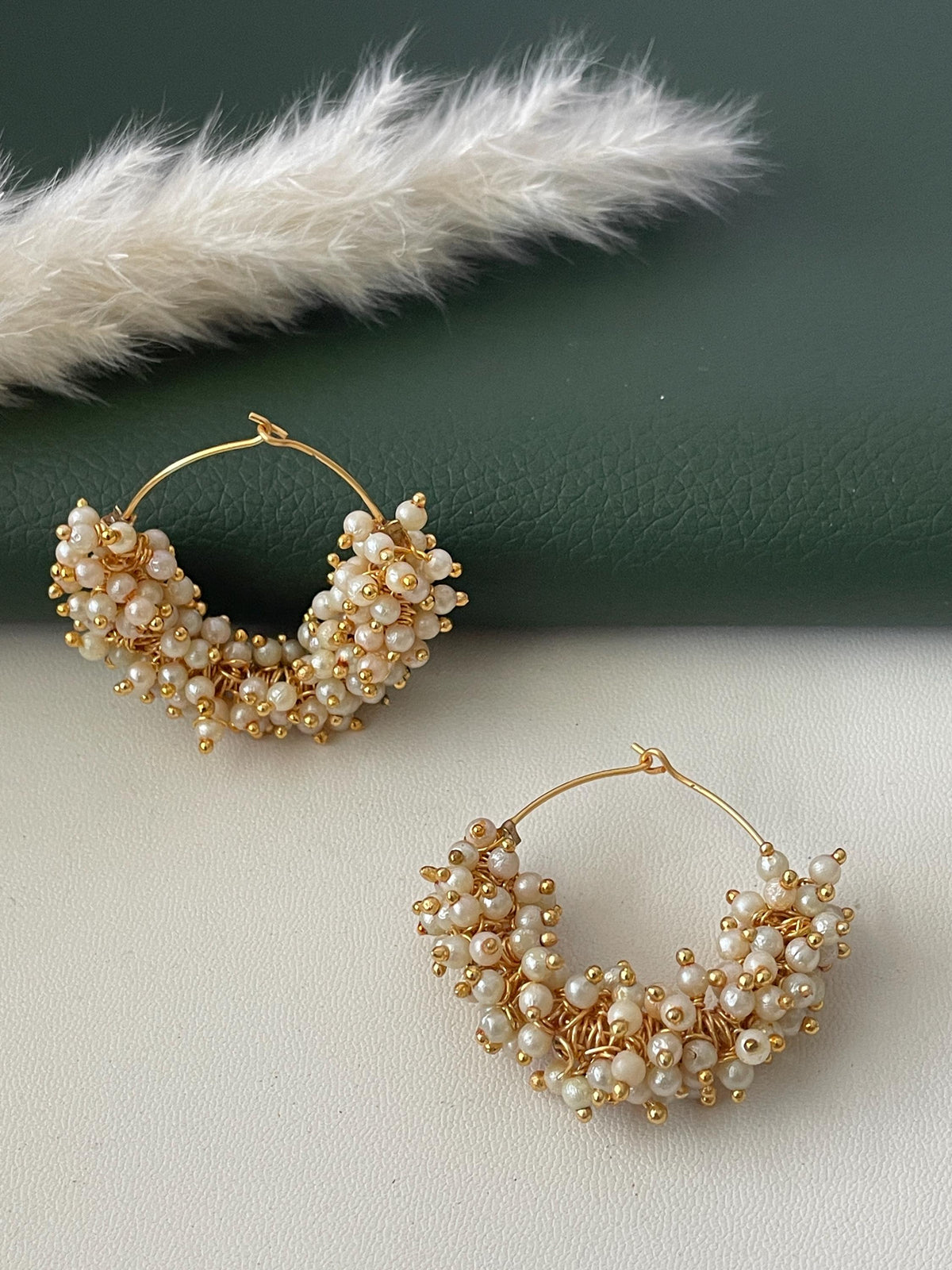 Gold plated clustered pearl hoop earrings . Perfect for any occasion