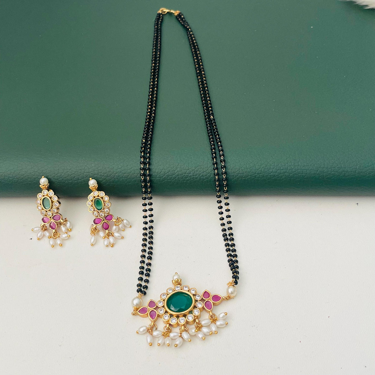 Gold Plated Tanmani Mangalsutra Set: Black Beads, Ruby Pendant