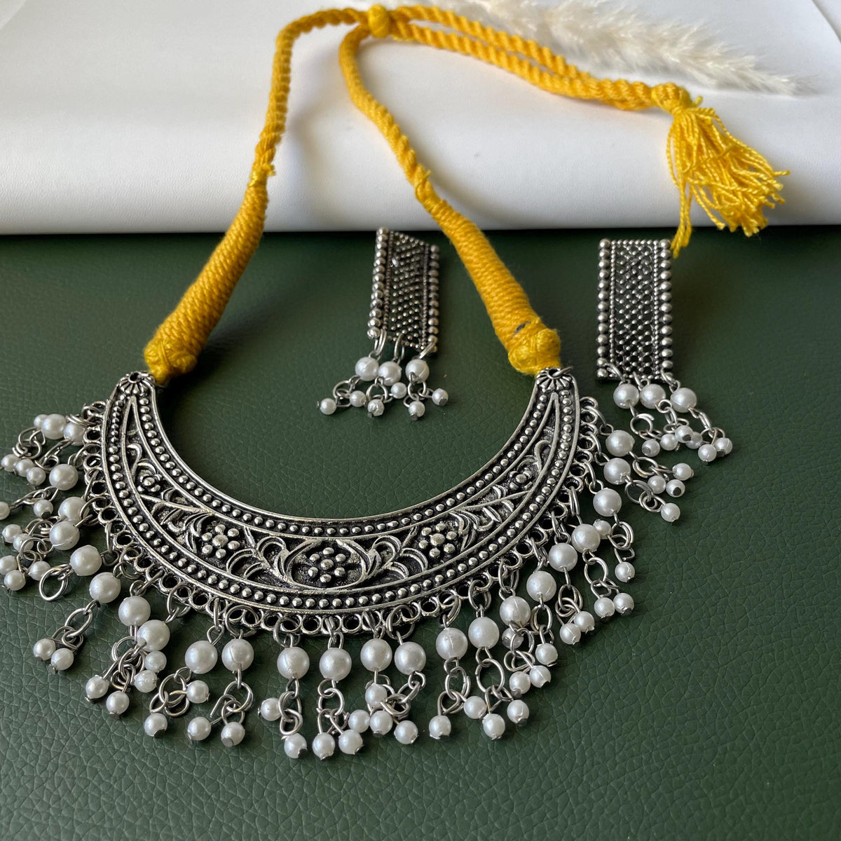 Oxidised thread necklace in red and yellow with matching earrings
