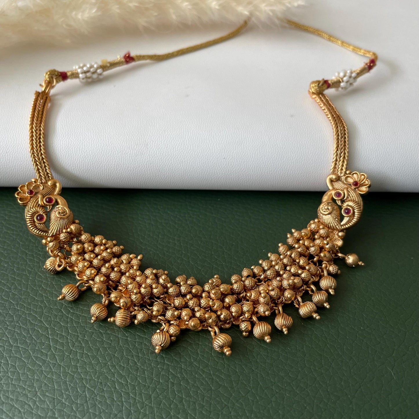 Short gold plated ghungaroo necklace set with peacock earrings