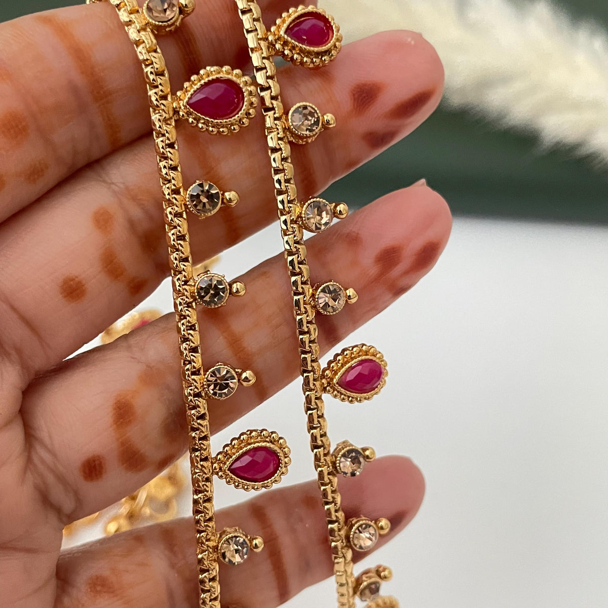 Gold plated bridal payal anklets in Ruby Green and lct