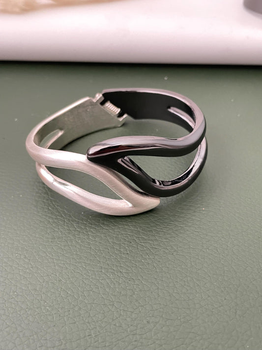 Silver and black fancy cuff bracelets