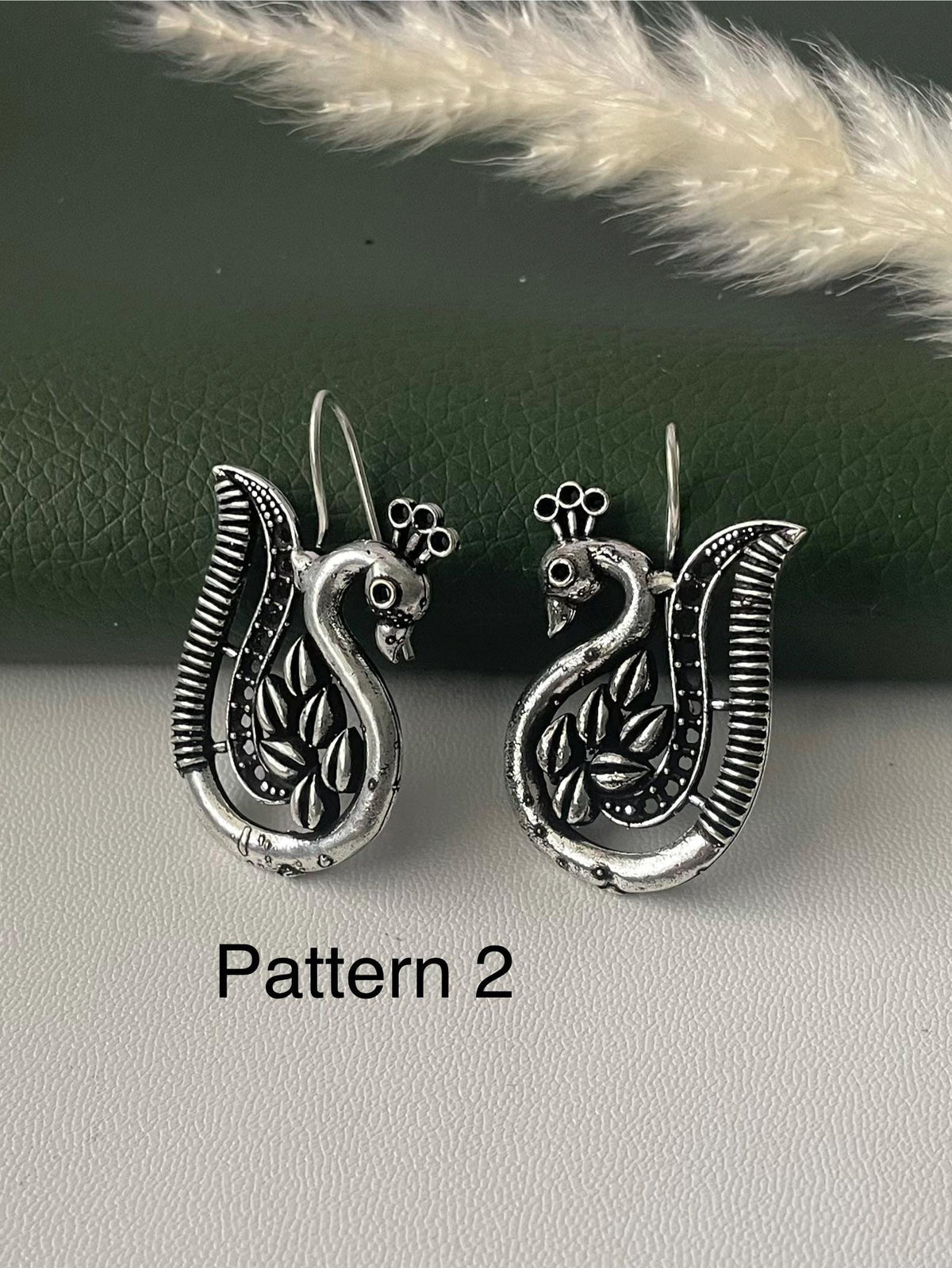 Oxidized peacock dangling earrings