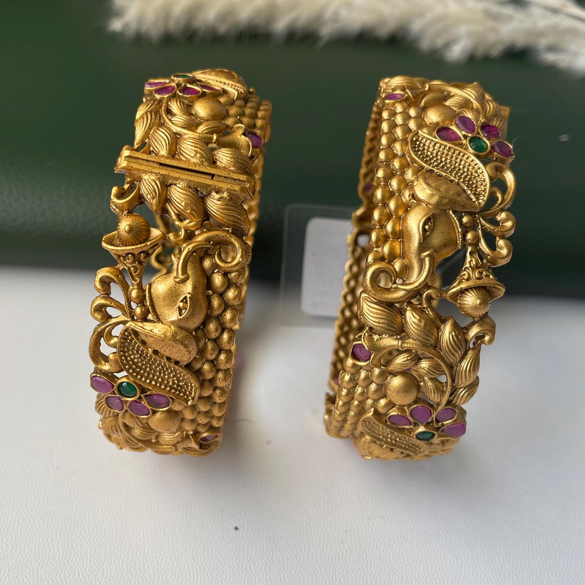 Gold plated kemp stone openable bangles with elephant flower carvings