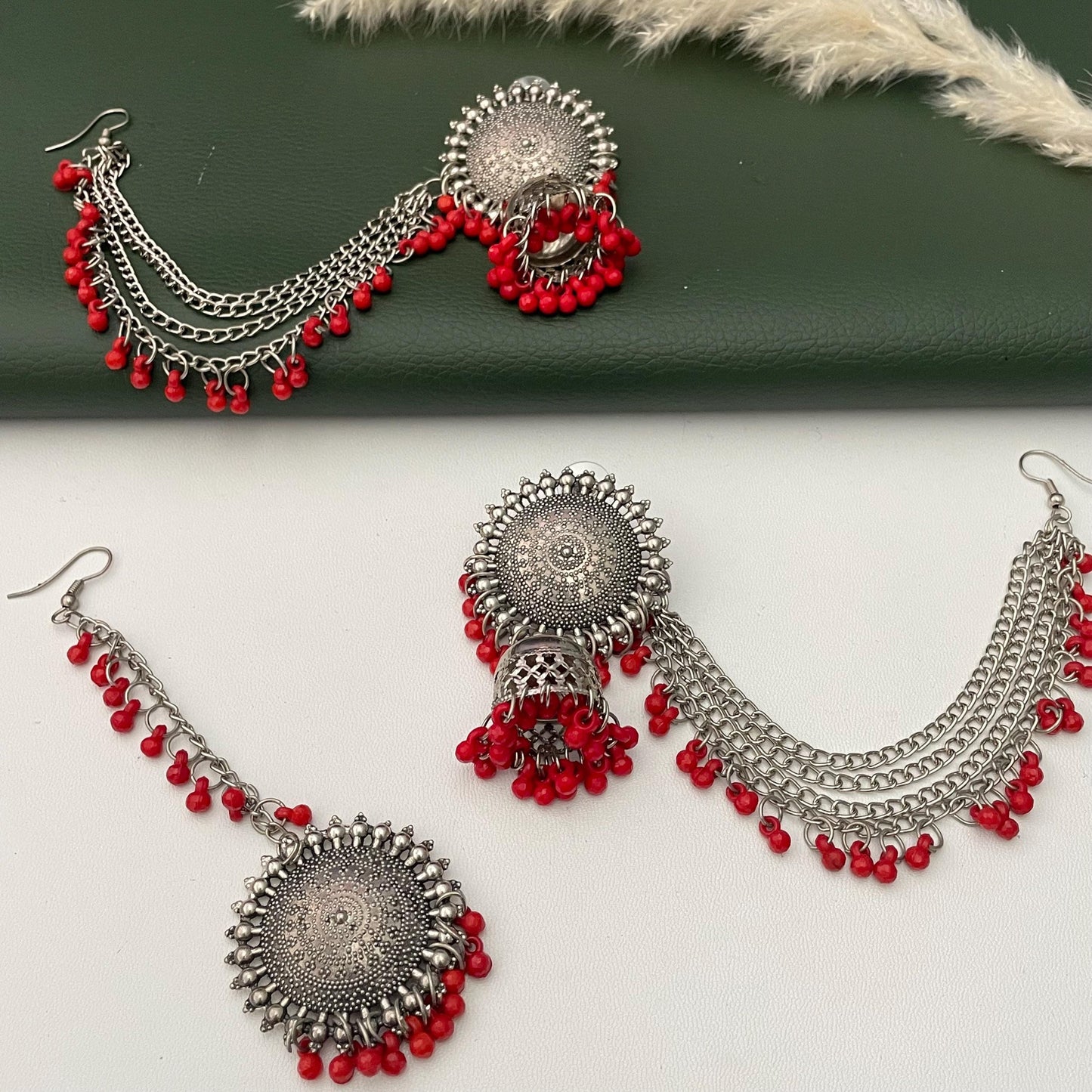 Oxidised jhumkis with ear-chains and Maang tikka