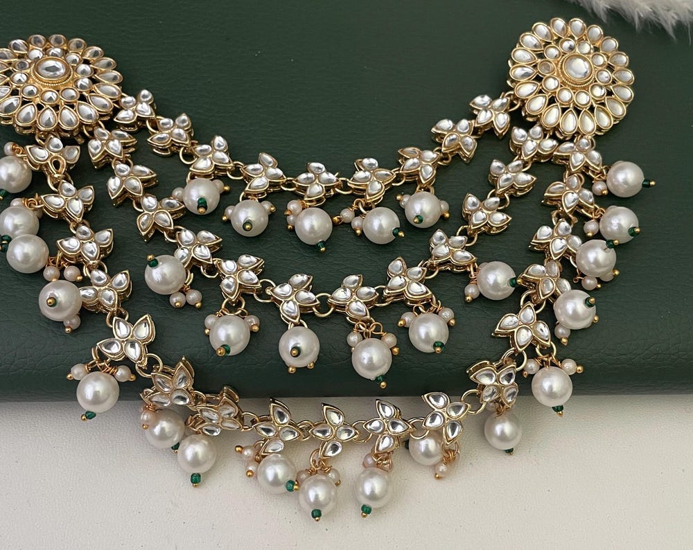 Gold plated kundan and pearl hair accessory