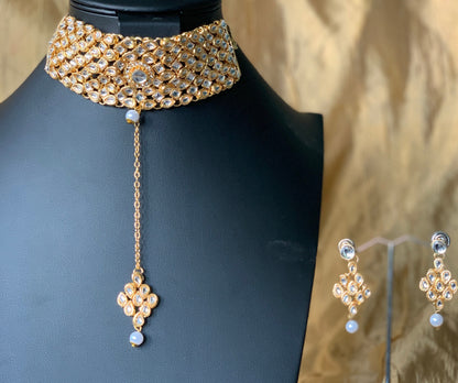 Gold plated kundan choker set with earrings and Maang tikka