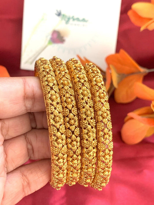 Gold plated bangles with small stunning flowers carving