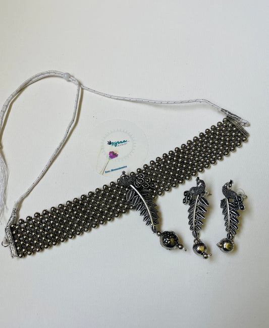 Oxidized Krishna Choker Necklace with Earrings: Red Beads