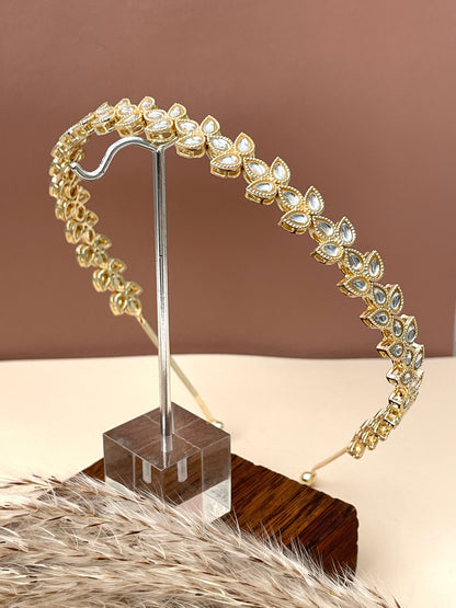 Gold plated kundan hair band in three petals design