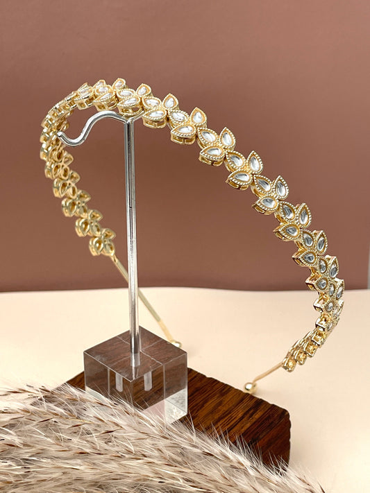Gold plated kundan hair band in three petals design