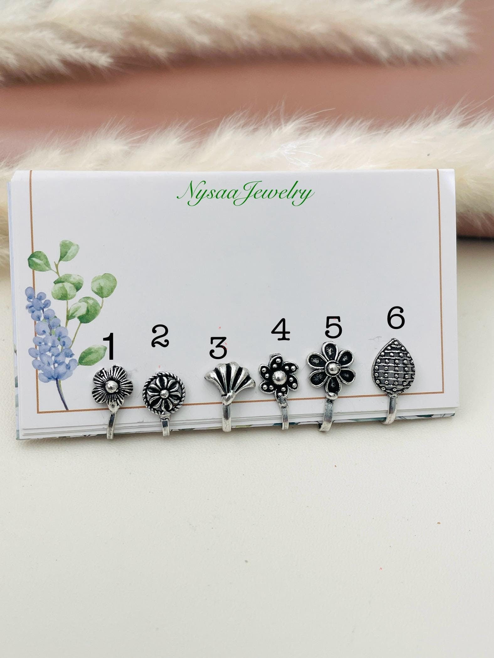 Oxidized cute little nose pins . 6 options from design flower , leaf and circular