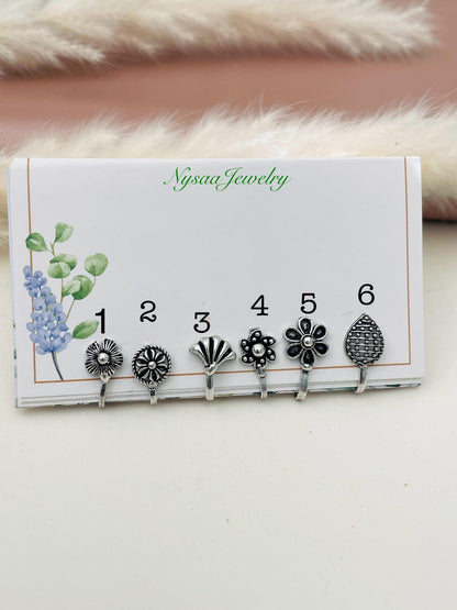 Oxidized cute little nose pins . 6 options from design flower , leaf and circular