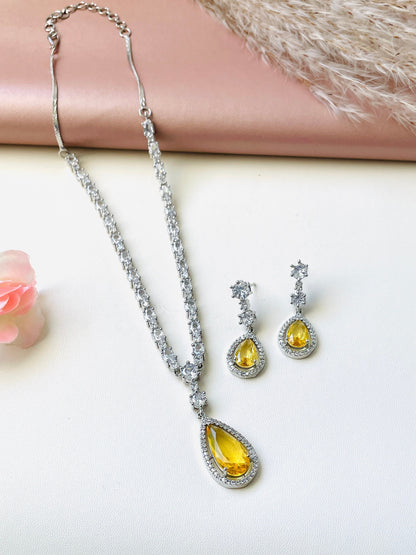 ADcubi zirconia Deepika Padukone necklace set . It’s white AD necklace with either amber or royal blue pendant with matching earrings.