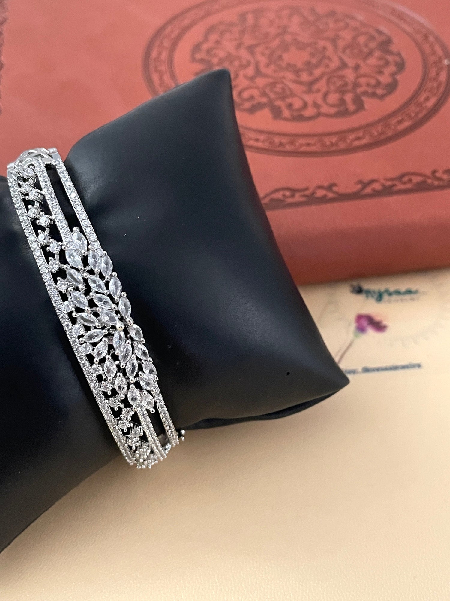 Cubic zirconia rhodium plated openable bracelet with beautiful flower detailing