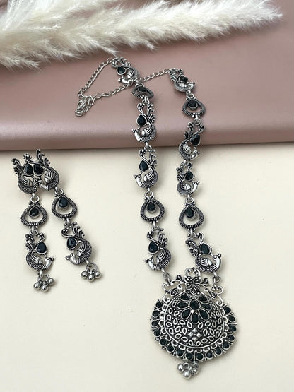 Long Oxidised black stone necklace set . This is high quality peacock themed set with black stones the long earrings are 3 inches long