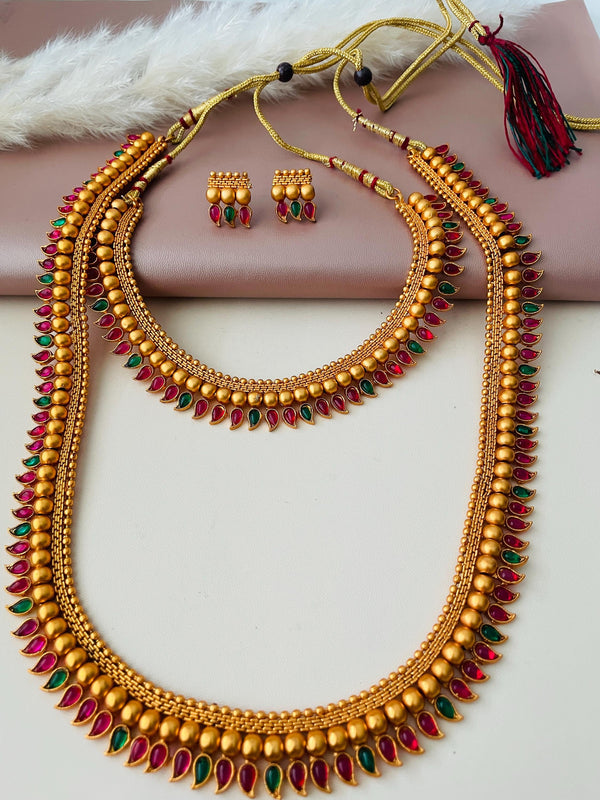 2 layered necklace set  with green n Ruby plastic gems . Really stunning imitation jewelry. Perfectfor dance recitals