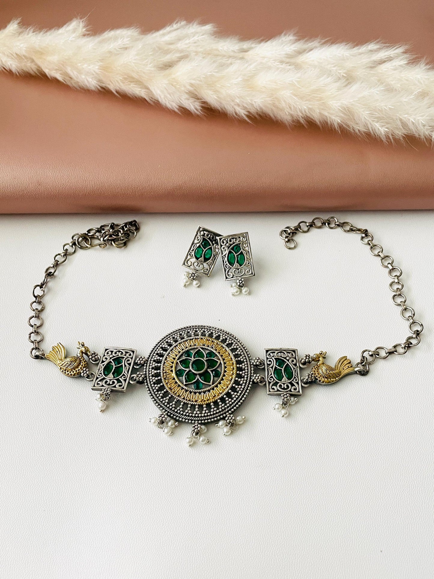 Dual tone Oxidised fancy necklace, high quality piece with two small earrings .The necklace is decorated with green stones, very stunning piece that goes with Indian or western outfits