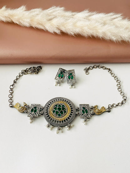 Dual tone Oxidised fancy necklace, high quality piece with two small earrings .The necklace is decorated with green stones, very stunning piece that goes with Indian or western outfits