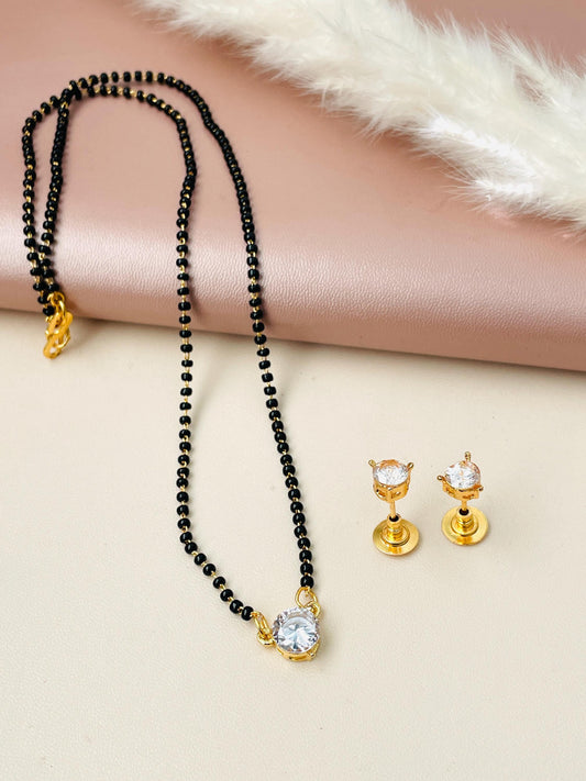 CZ solitaire mangalsutra set with matching earrings . 18 inches long. Gold plated