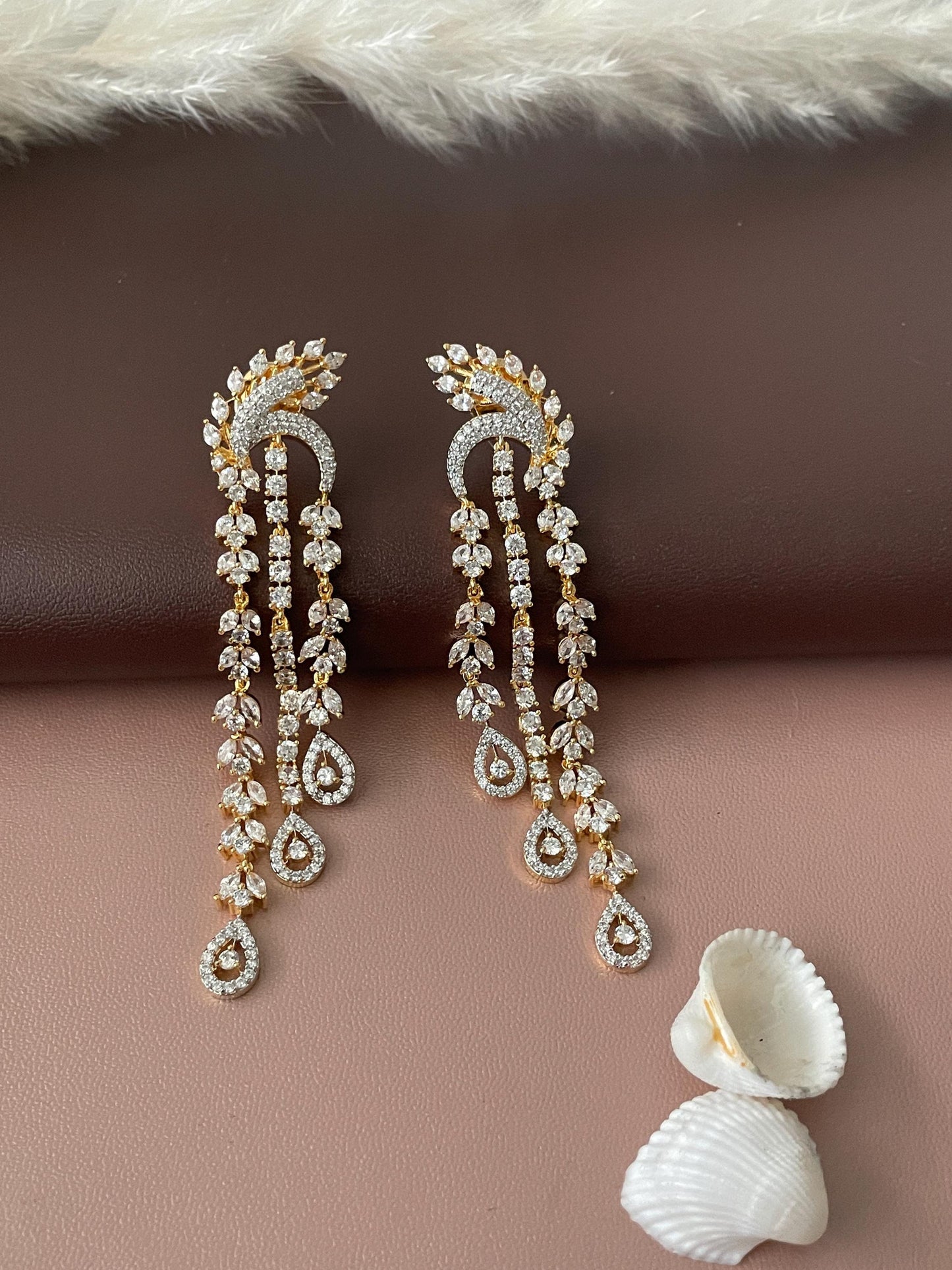 Cubic zirconia gold plated Indian earrings . Very stunning 3 inches long .