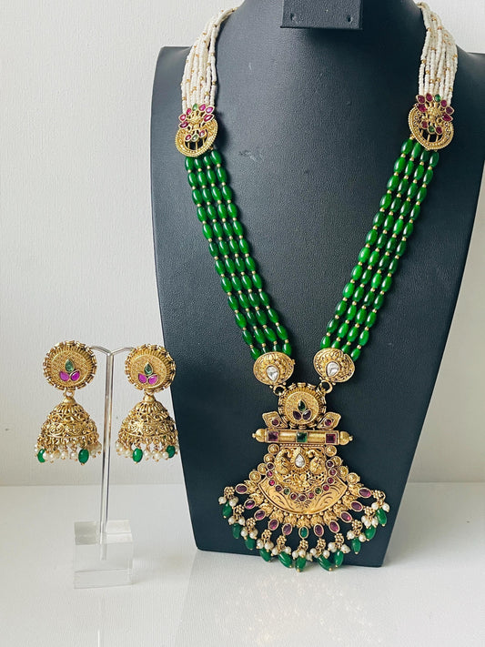 Antique gold plated high quality necklace set .Made with green beads , kemp stones pearl and a big pendant . This South Indian style necklace set is perfect for bride or Diwali celebration