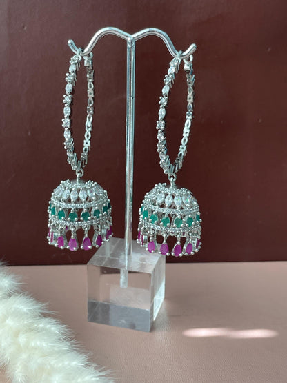 Green and magenta AD CZ jhumki hoops . These are high quality cubic zirconia hoops and jhumki dangle with green and magenta gems