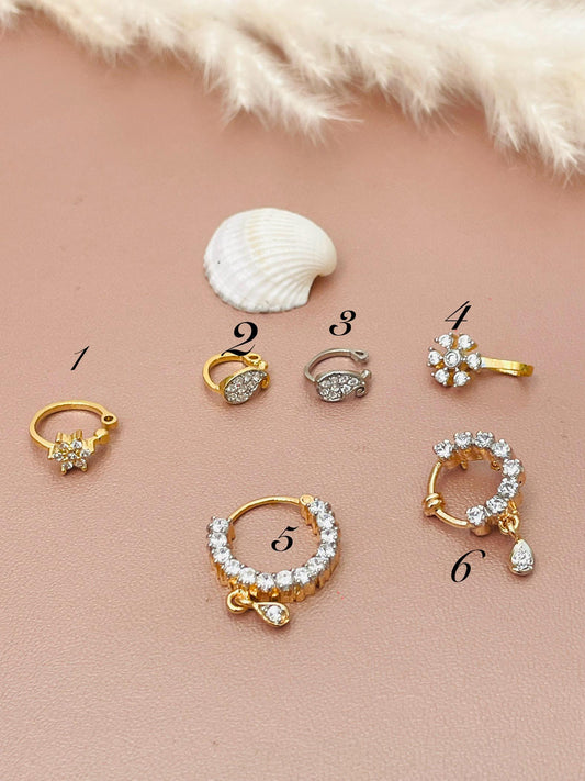 Gold plated cubic zirconia nose pins . Delicate and stunning pieces .