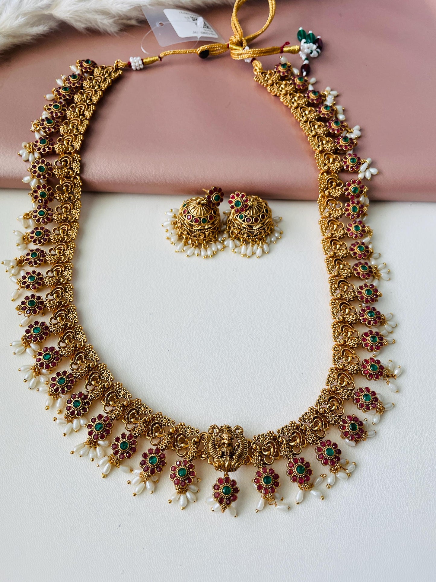 Stunning kemp stone necklace set with matching jhumkis .