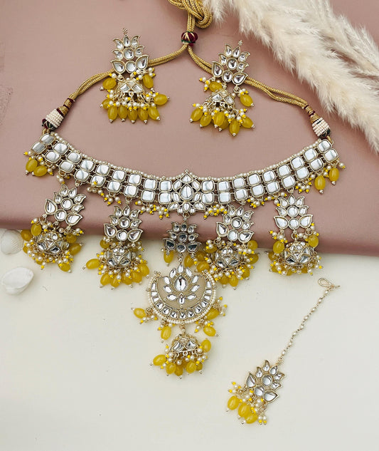 Stunning yellow beads and affordable kundan necklace set with matching earrings and maang tika . Perfect for Mehandi , sangeet or even Indian wedding