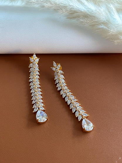 Long high quality cubic zirconia dangled earrings with flower shape .