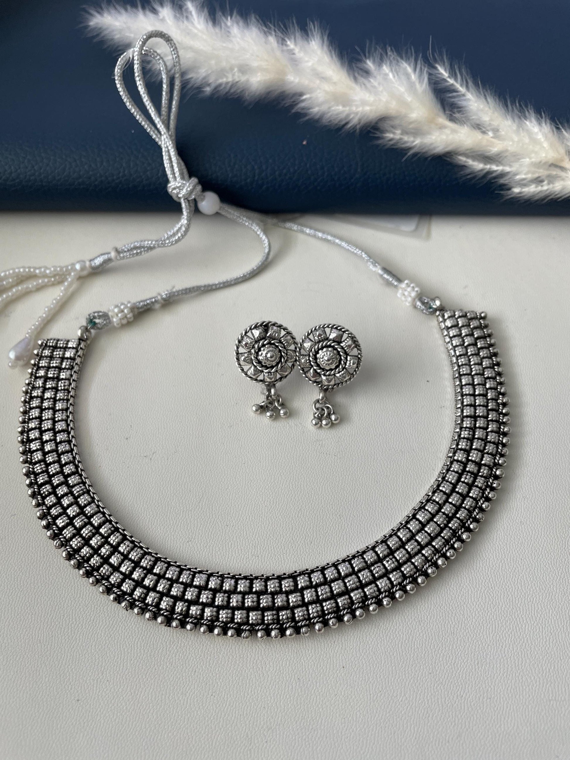 Oxidised collar necklace with earrings. Simple elegant and classy . Very lightweight , silver lookalike high quality necklace set