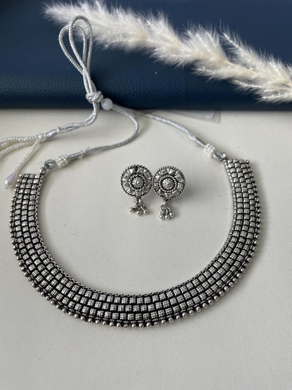 Oxidised collar necklace with earrings. Simple elegant and classy . Very lightweight , silver lookalike high quality necklace set