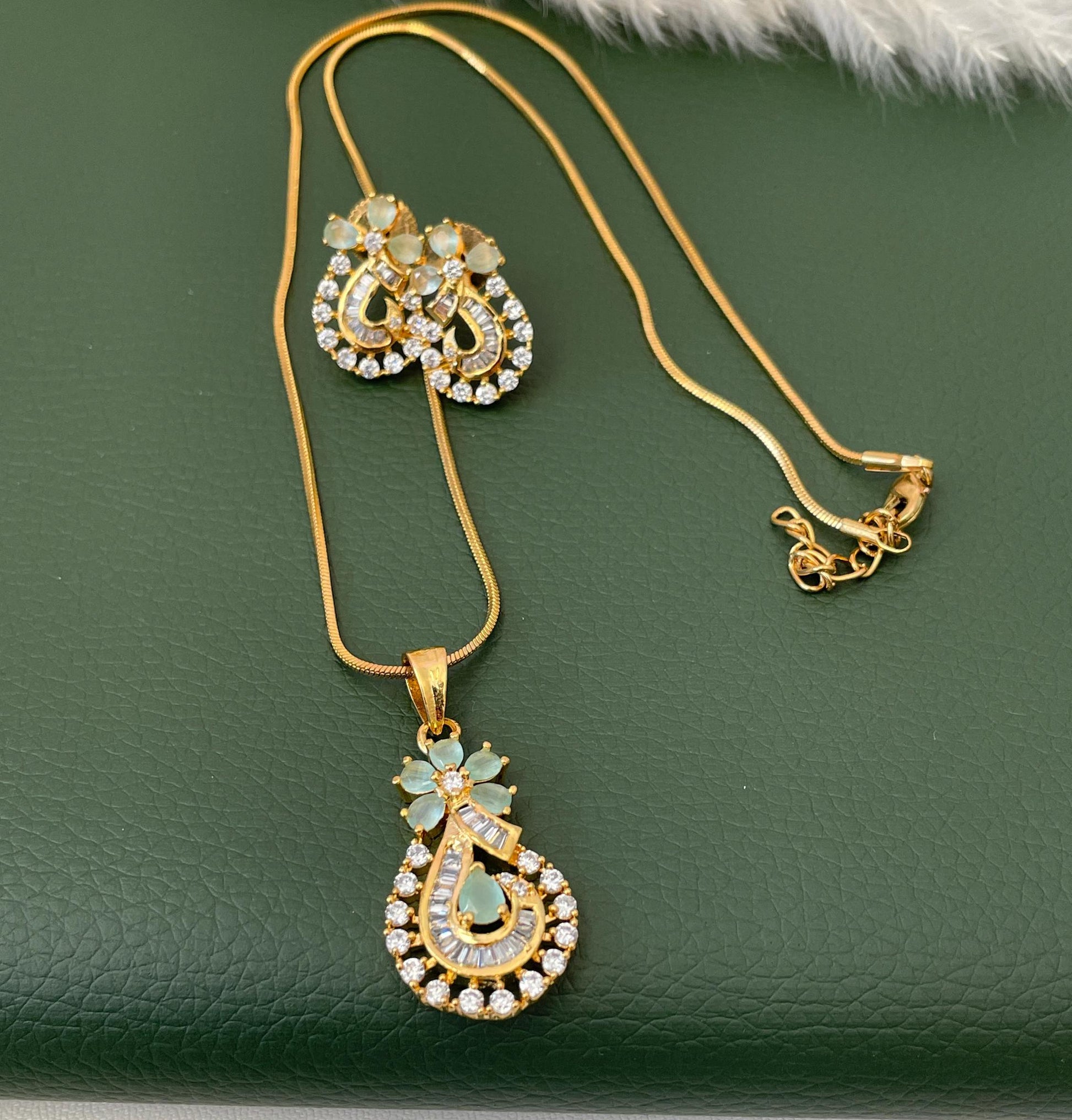 Stunning yet very elegant mint CZ pendant necklace set with matching earrings. Gold plated , very high quality