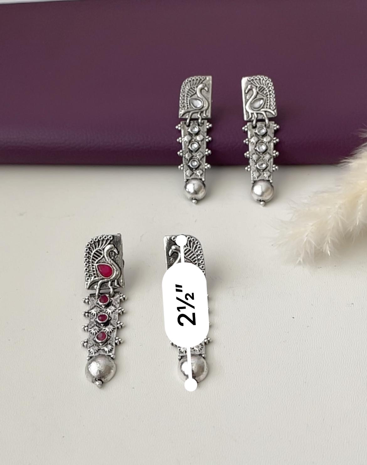 Silver lookalike peacock Oxidised earrings in Ruby and white