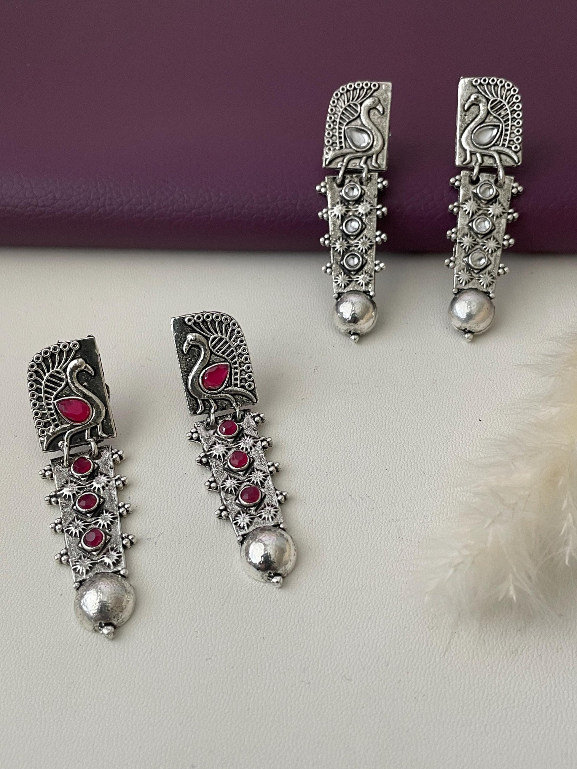 Silver lookalike peacock Oxidised earrings in Ruby and white
