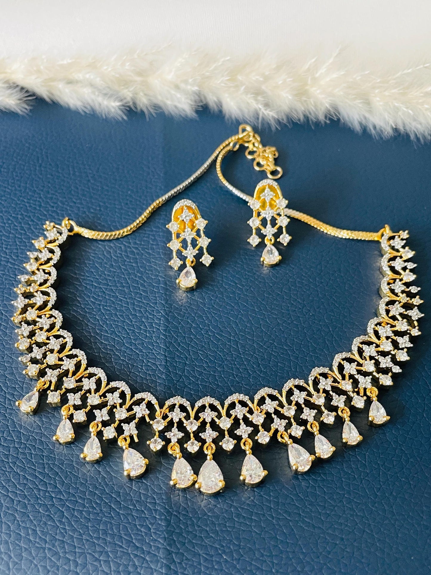 Beautiful high quality twotoned CZ necklace set with earrings . Shine in these stone shows the quality of this piece.