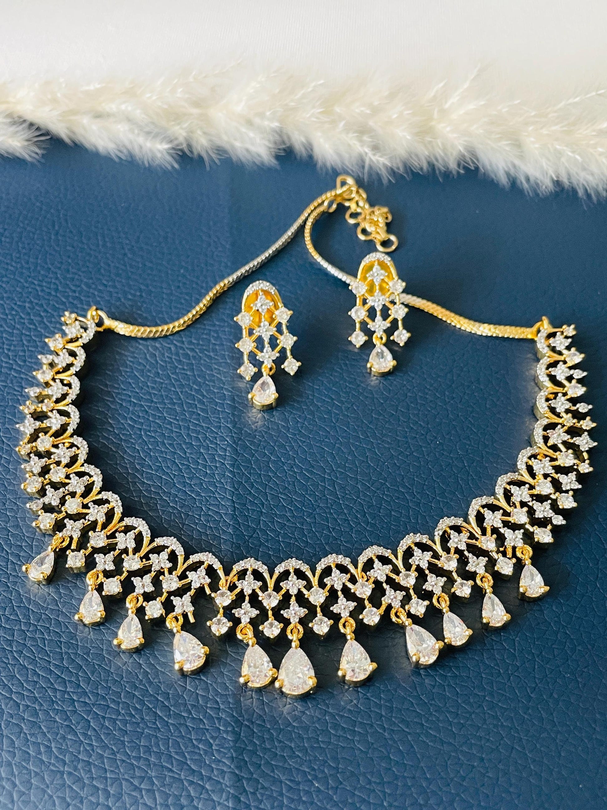 Beautiful high quality twotoned CZ necklace set with earrings . Shine in these stone shows the quality of this piece.