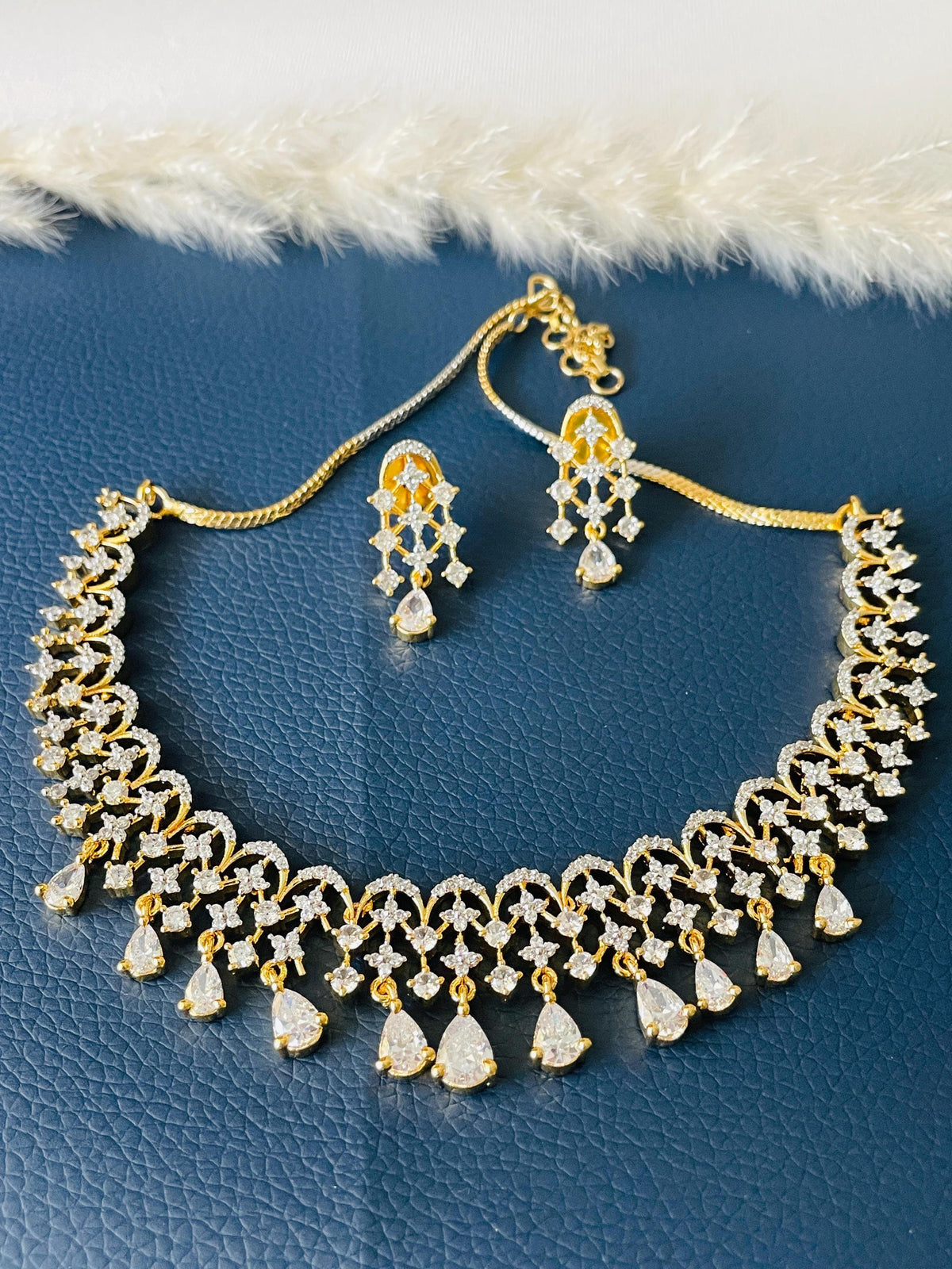 Beautiful high quality twotoned CZ necklace set with earrings . Shine in these stone shows the quality of this piece.