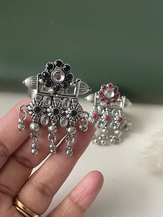 High quality Oxidised finger ring available in two colors . Ruby and black . Unique design and adjustable.