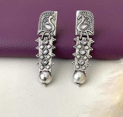 Silver lookalike peacock Oxidised earrings in Ruby and white