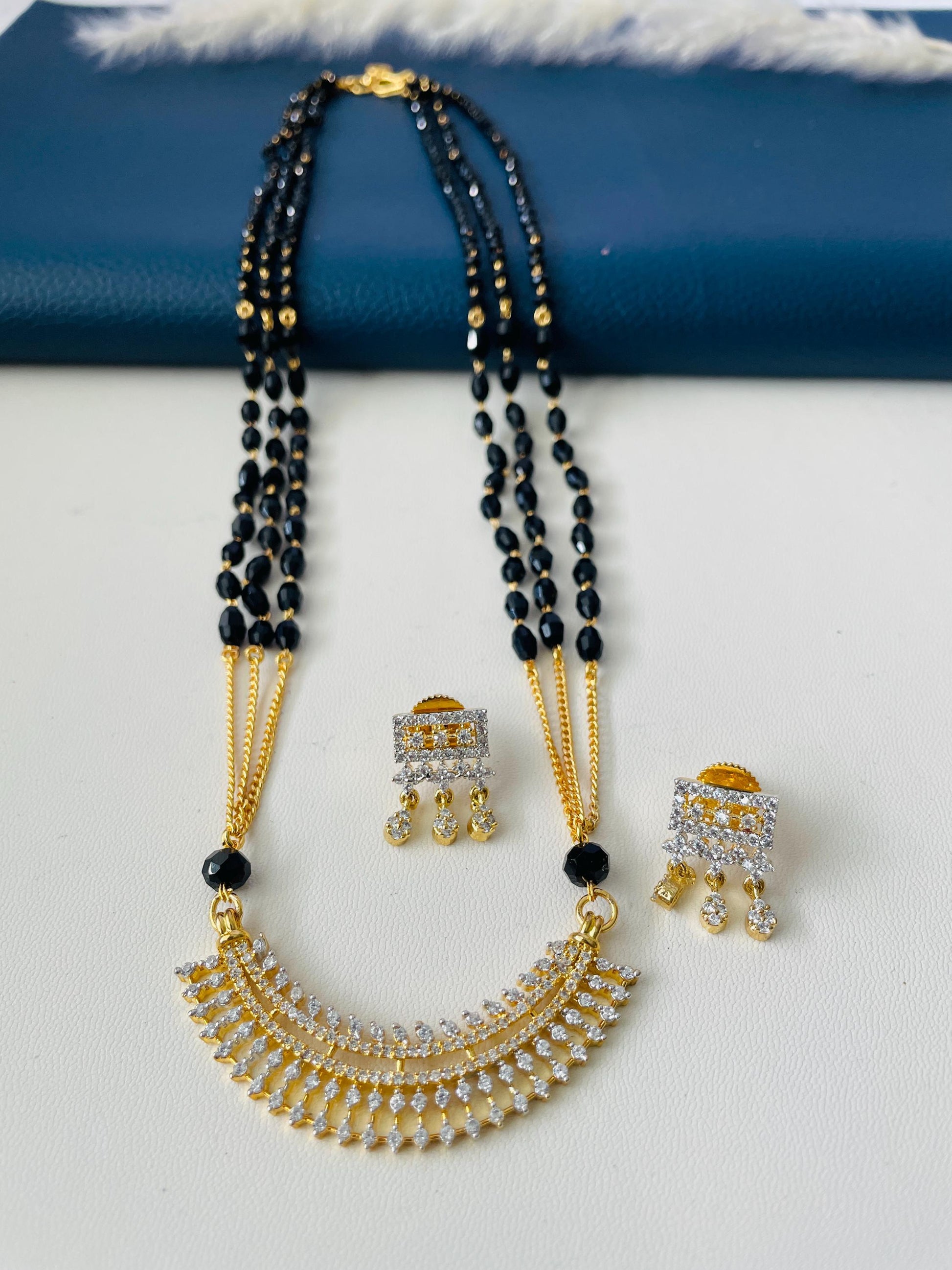 Three strand CZ pendant gold plated black beaded Mangalsutra