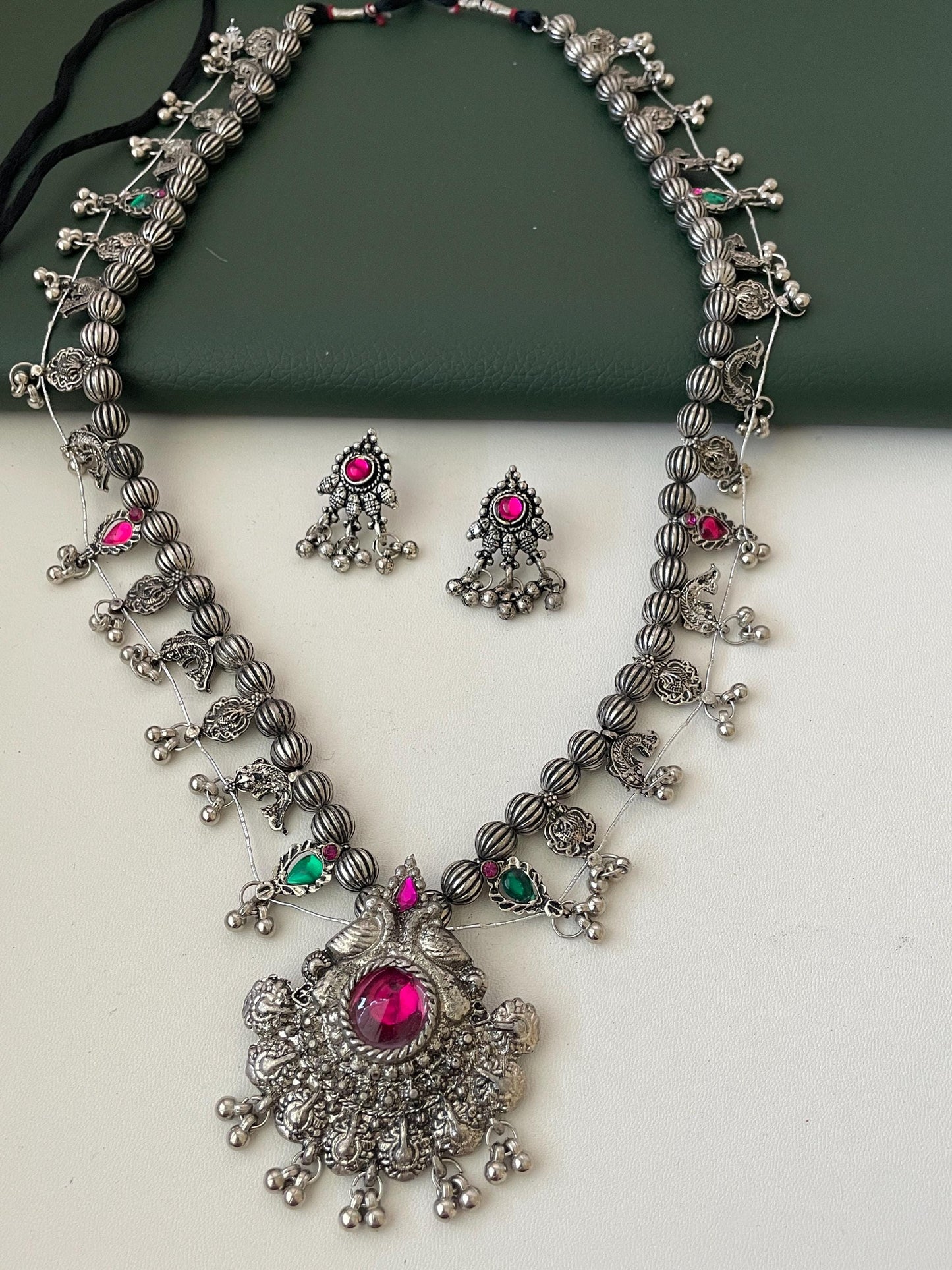 Oxidised kolhapuri saaj With matching earrings . This is tmore like black than shiny Oxidised set . 24 inch long with traditional motif like masali ( fish ), paan ( leaf)