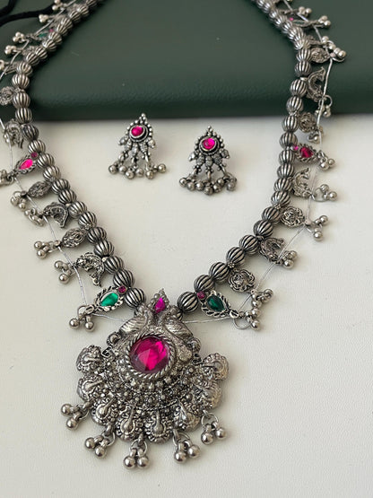 Oxidised kolhapuri saaj With matching earrings . This is tmore like black than shiny Oxidised set . 24 inch long with traditional motif like masali ( fish ), paan ( leaf)