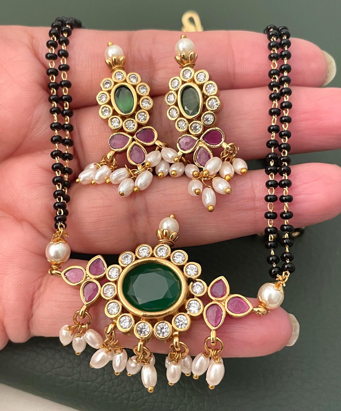 Gold Plated Tanmani Mangalsutra Set: Black Beads, Ruby Pendant