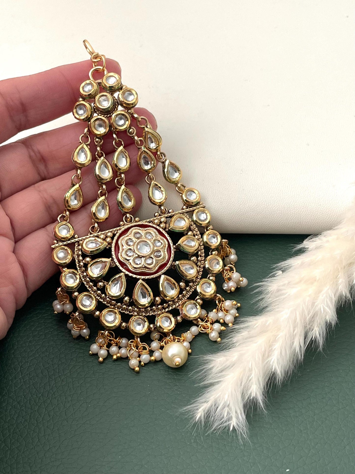 Kundan gold plated pasa jhoomar or hair accessory. 4 inch long adorned with pearl .Perfect for wedding parties