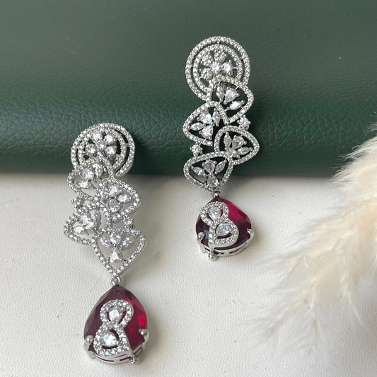 Rhodium plated cubic zirconia and Ruby earrings. Moden design and 3.5 inches long . Stunning high quality piece .
