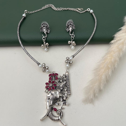 Ganapati Oxidised neckpiece with matching earrings. Studded with Ruby and white stones . Light garba jewelry